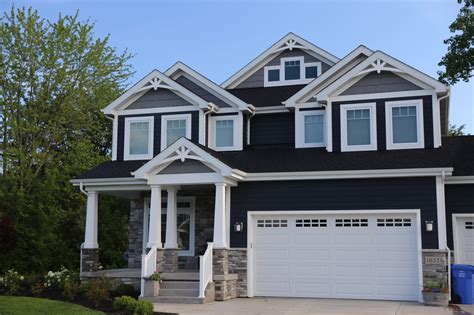 dark blue house white trim.